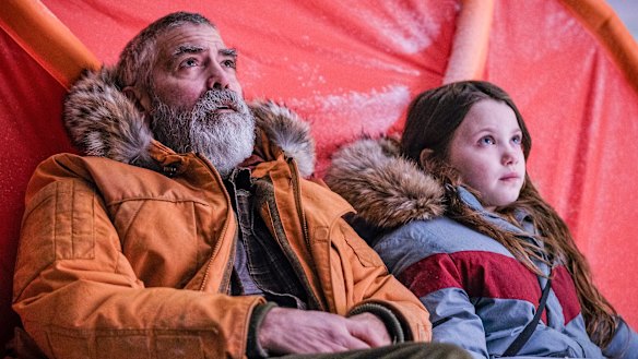 Caoilinn Springall (right) and George Clooney in a scene from The Midnight Sky.