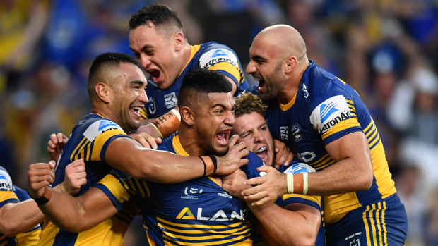 Stadium act: The Eels celebrate one of their nine tries.