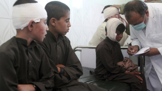 Injured boys receive treatment in a hospital after a car bomb attack in Ghazni province, central Afghanistan, on Sunday, July 7.