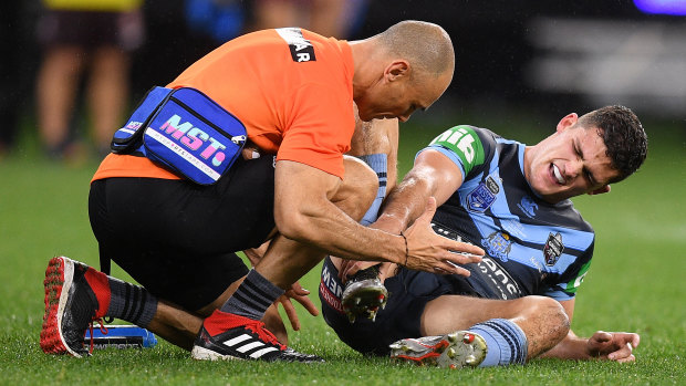 Nathan Cleary receives treatment during the first half of Origin II.