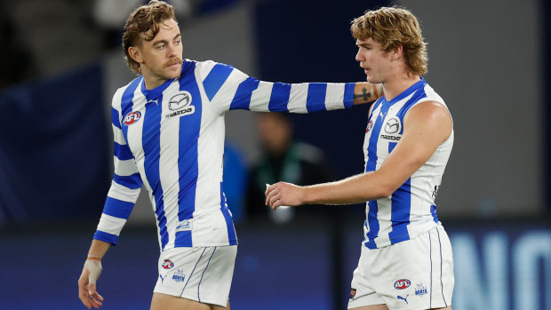 Hugh Greenwood consoles Jason Horne-Francis after another North Melbourne loss.