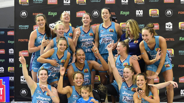 Southside Flyers celebrate after their 2020 WNBL grand final victory.
