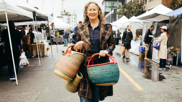 Dianna Cohen, who has gone plastic free, walks through a farmers market in Los Angeles