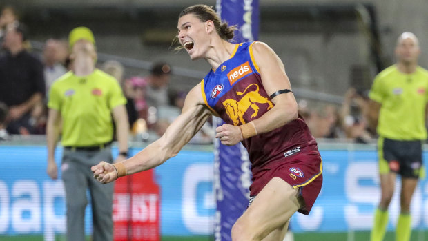 Hip hooray: Brisbane forward Eric Hipwood celebrates after bagging five goals for the Lions in a match-winning performance against the Demons.