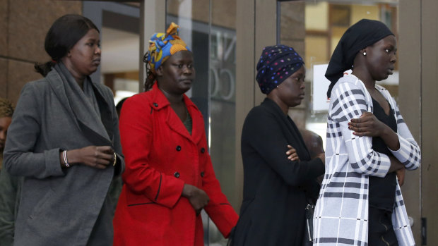 Grieving family and family friends of Natalina Angok leave the Magistrates Court on Friday.