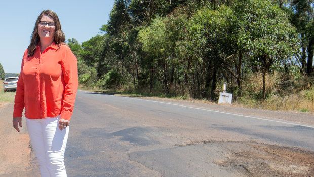 South-West Coast Liberal MP Roma Britnell next to a massive pot hole. 