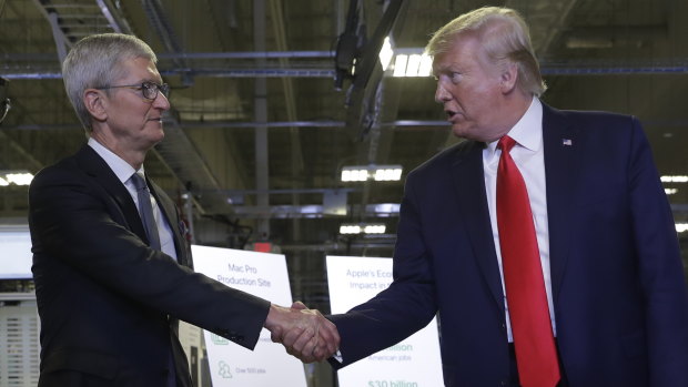'This is a very special day': Donald Trump and Apple boss Tim Cook during the tour of the Texas plant.