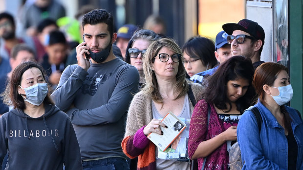 Applicants line up at Centrelink amid the COVID-19 joblessness shock.