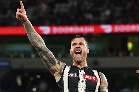 Tim Membrey of the Magpies kicks a goal.