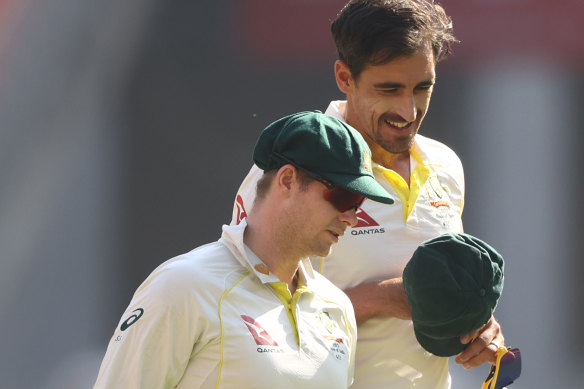 Smith and Starc in consultation.