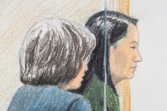 Meng Wanzhou, right, sits beside a translator during a bail hearing at British Columbia Supreme Court in Vancouver, on Friday.