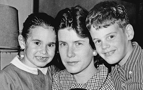 FILE - In this May 3, 1965, file photo, Shirley Ann Grau, winner of a Pulitzer for her third novel "The Keepers of the House," is shown in New Orleans, with her children, Nora, 5, William, 6 months, and Ian, 8. Grau, a Pulitzer Prize-winning fiction writer whose stories and novels told of both the dark secrets and the beauty of the Deep South, has died at age 91. Her daughter Nora McAlister said Wednesday, Aug. 5, 2020, that Grau died Monday in a memory care facility of complications from a stroke. (AP Photo, File)