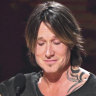 Emotional Keith Urban wins top prize at US country music awards
