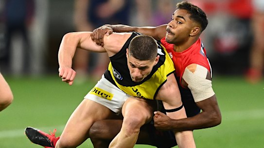 Dion Prestia is tackled by Kysaiah Pickett.