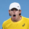Alex de Minaur celebrates his singles win.