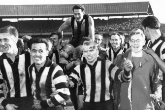 Teammates carry Murray Weideman off after Collingwood’s victory over Melbourne in the 1958 grand final.