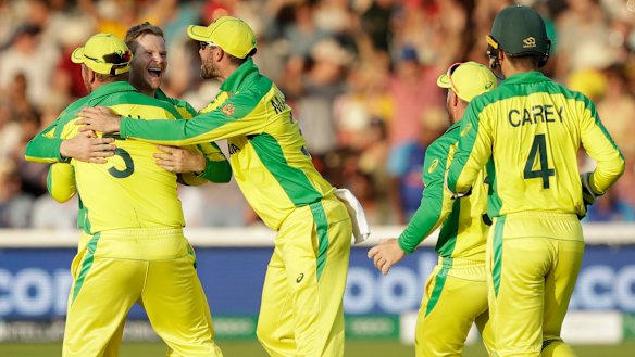 Top two beckons: The Australians celebrate the wicket of New Zealand's Colin de Grandhomme at Lord's.