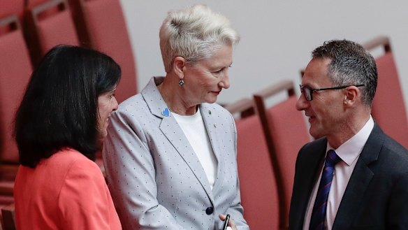 Crossbench MPs Julia Banks and Kerryn Phelps shake hands with Greens leader Richard Di Natale after the Senate agreed on House's amendments to its amendments to the Home Affairs Legislation Amendment Bill.