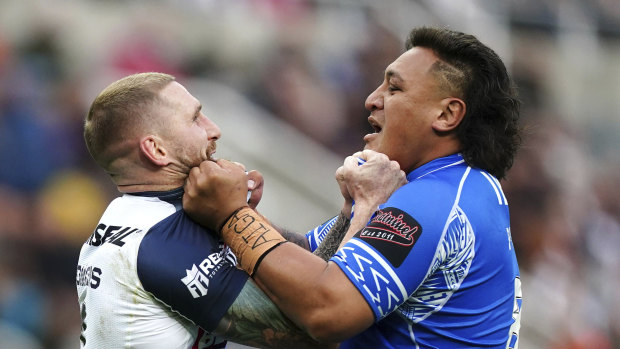 Tempers flare between England’s Sam Tomkins, left and Samoa’s Josh Papali’i.