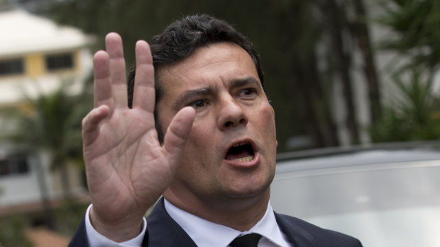 Brazilian Judge Sergio Moro talks to the press as he leaves a meeting with President-elect Jair Bolsonaro, outside Bolsonaro's home in Rio de Janeiro, on Thursday.