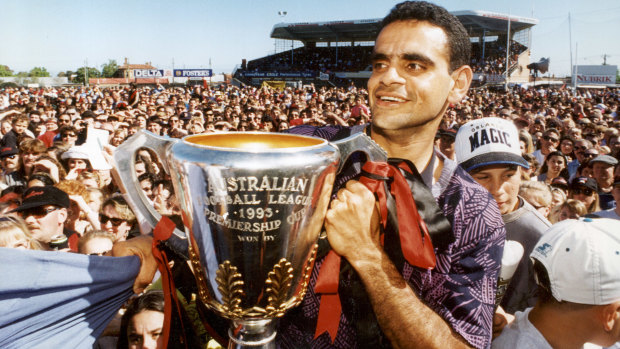 Michael Long gets his hands on the cup.