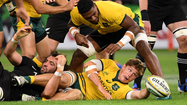 Michael Hooper of the Wallabies recycles the ball during the Bledisloe Cup match between the Australian Wallabies and the New Zealand All Blacks at Optus Stadium in Perth.