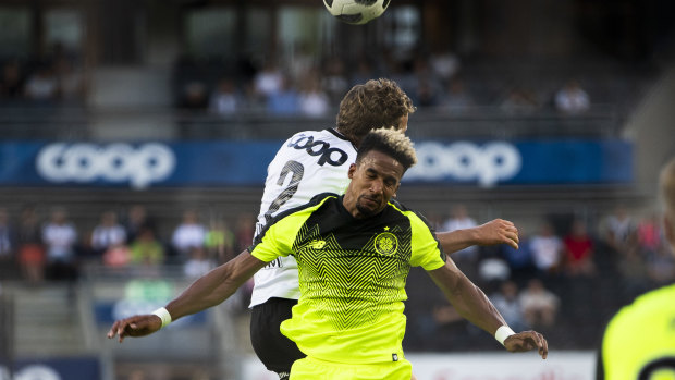 Honours even: Scott Sinclair, front, challenges for the ball with Vegar Eggen Hedenstad.
