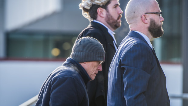 David Eastman, left, arrives at the ACT Supreme Court with his lawyers for the first day of his trial. 