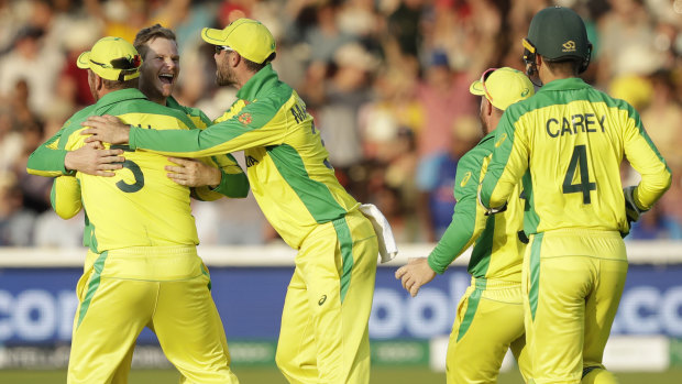 Top two beckons: The Australians celebrate the wicket of New Zealand's Colin de Grandhomme at Lord's.