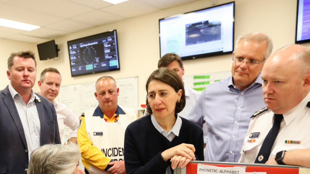 Prime Minister Scott Morrison and Premier Gladys Berejiklian, talking the volunteers inside the Wollondilly unit emergency fire control centre.
