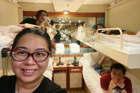 In for the long haul: Australian woman Aun Na Tan and her family in their cabin on board the Diamond Princess, which has been docked in quarantine in Yokohama.
