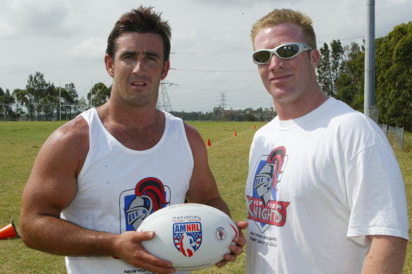 Andrew Johns receiving a New York Knights singlet and ball from Matt Astill in 2003.