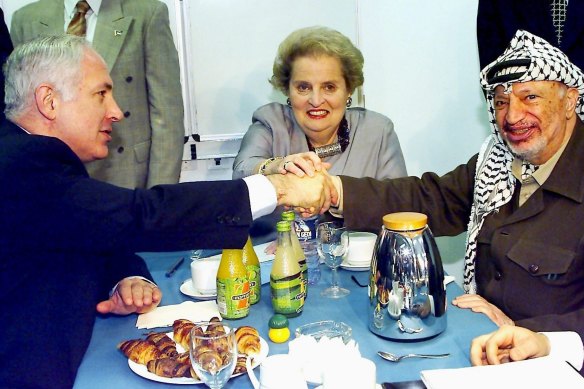 Albright's gender was of no issue to Middle Eastern leaders, enabling her to hold talks with the likes of Israeli PM Benjamin Netanyahu, left, and Palestinian president Yasser Arafat in 1998. 