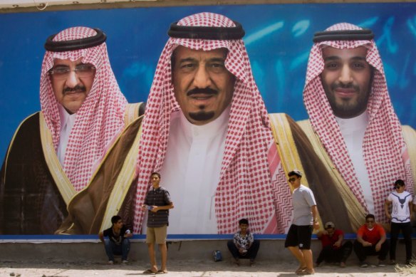 A billboard showing King Salman, centre, his son Mohammed bin Salman, right, and former designated heir Mohammed bin Nayef in Taif, Saudi Arabia.  