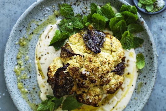 Whole roasted cauliflower with hummus and honey.