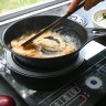 Making scrambled eggs on a portable induction cooker.