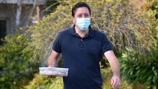 Matthew Guy delivers biscuits to the media on Monday morning.