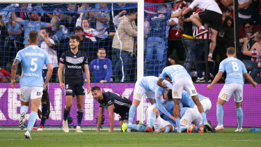 City celebrate Dario Vidosic's late equaliser in the thrilling Melbourne derby.