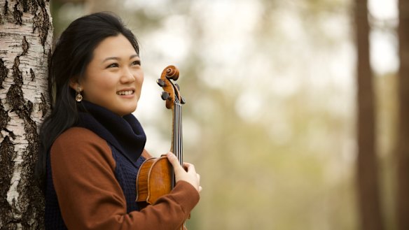 Emily Sun seems to breathe as one with pianist Andrea Lam in their expressive collaboration.