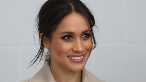Meghan Markle  smiles during a visit with Prince Harry to the  Eikon Exhibition Centre in Lisburn, Northern Ireland.
