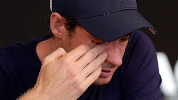 Andy Murray wipes tears from his face.