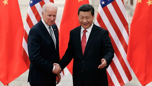 Joe Biden with Xi Jinping, pictured in 2013 when Biden was US vice-president. 