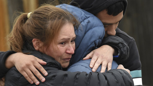 Family members mourn at the scene where their loved ones were killed in Colorado Springs, Colorado. 