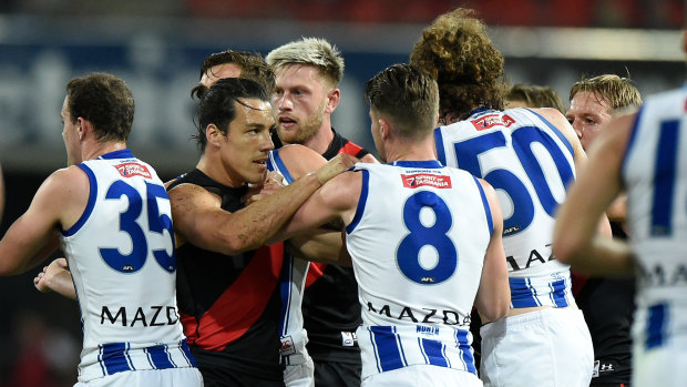 Tempers fray: Essendon's Dylan Shiel (left) gets involved in some push and shove with North Melbourne players during their round 6 clash.