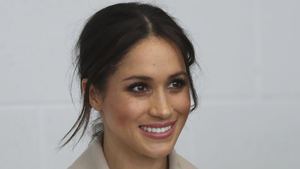 Meghan Markle  smiles during a visit with Prince Harry to the  Eikon Exhibition Centre in Lisburn, Northern Ireland.