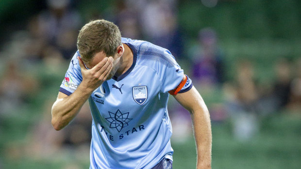 Alex Wilkinson reacts after a head knock during the heavy defeat.