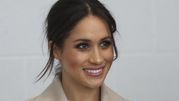 Meghan Markle  smiles during a visit with Prince Harry to the  Eikon Exhibition Centre in Lisburn, Northern Ireland.