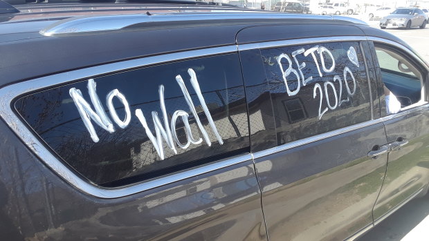 Elisa O'Callaghan, a refugee activist from Dallas, painted "no wall" onto her car and drove for 10 hours to protest Trump's rally in El Paso.
