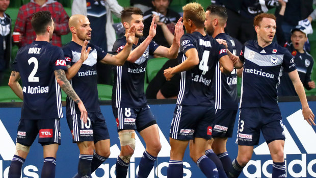 Doubling up: James Troisi celebrates after firing in Victory's second goal.