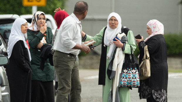 Families seen outside a mosque following a shooting at the Masjid Al Noor mosque in Christchurch.